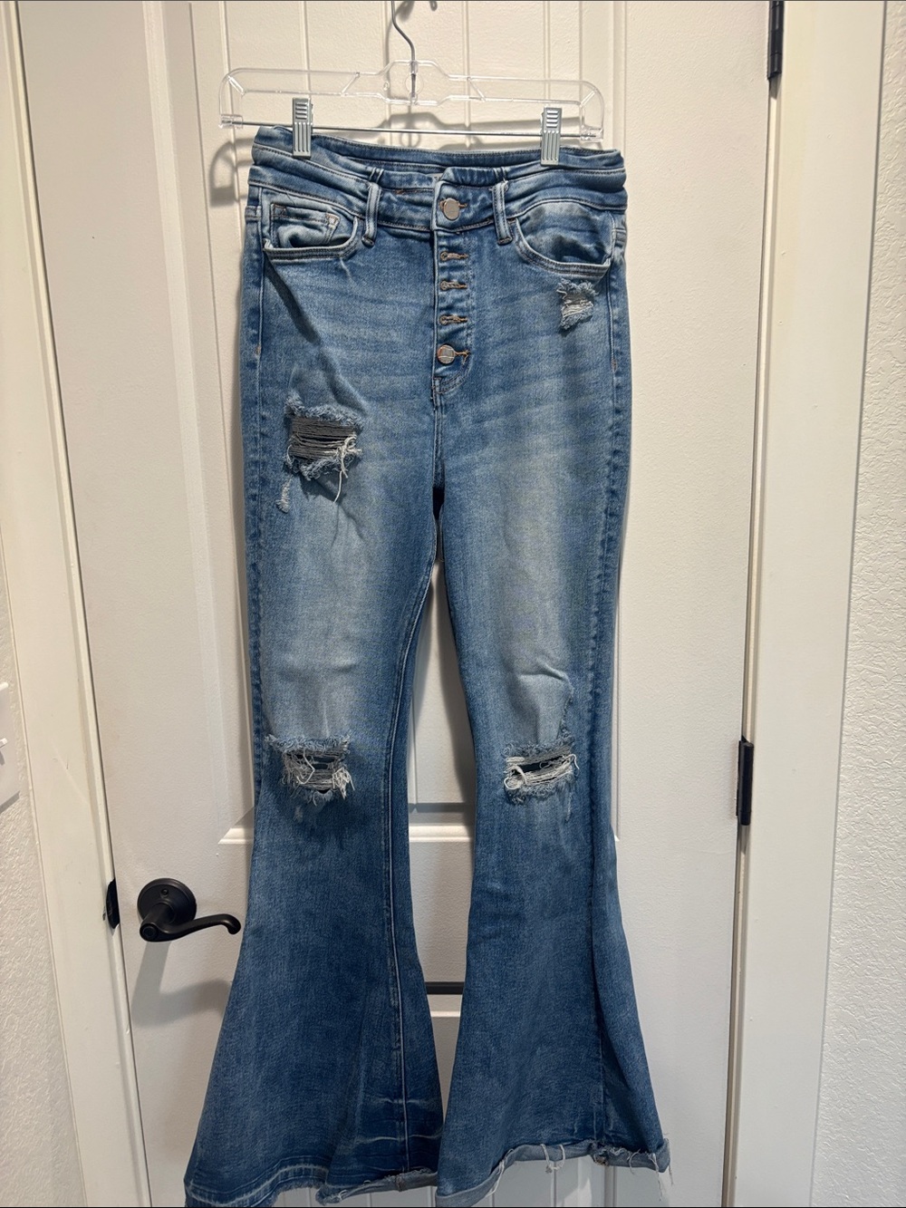 High-Rise Distressed Flare Jeans in Light Blue